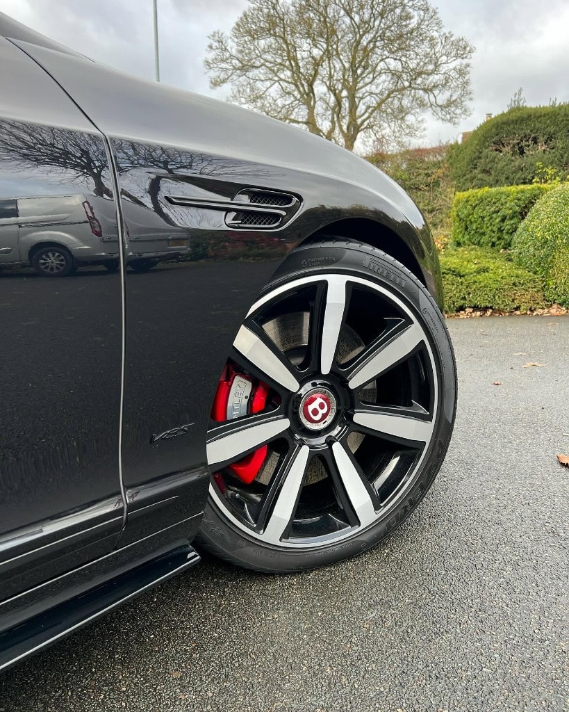 Bentley Continental alloy wheel with red calipers, cleaned and protected