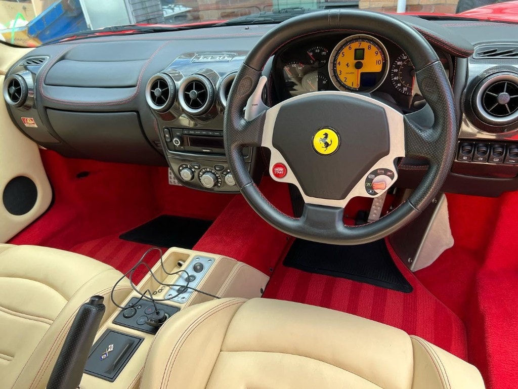 Ferrari F430 cockpit with red carpets and cream leather, cleaned