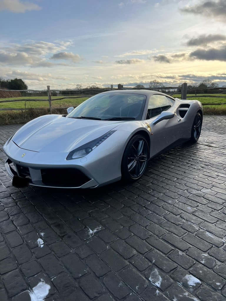 Silver Ferrari 488 GTB front three-quarter, deep gloss