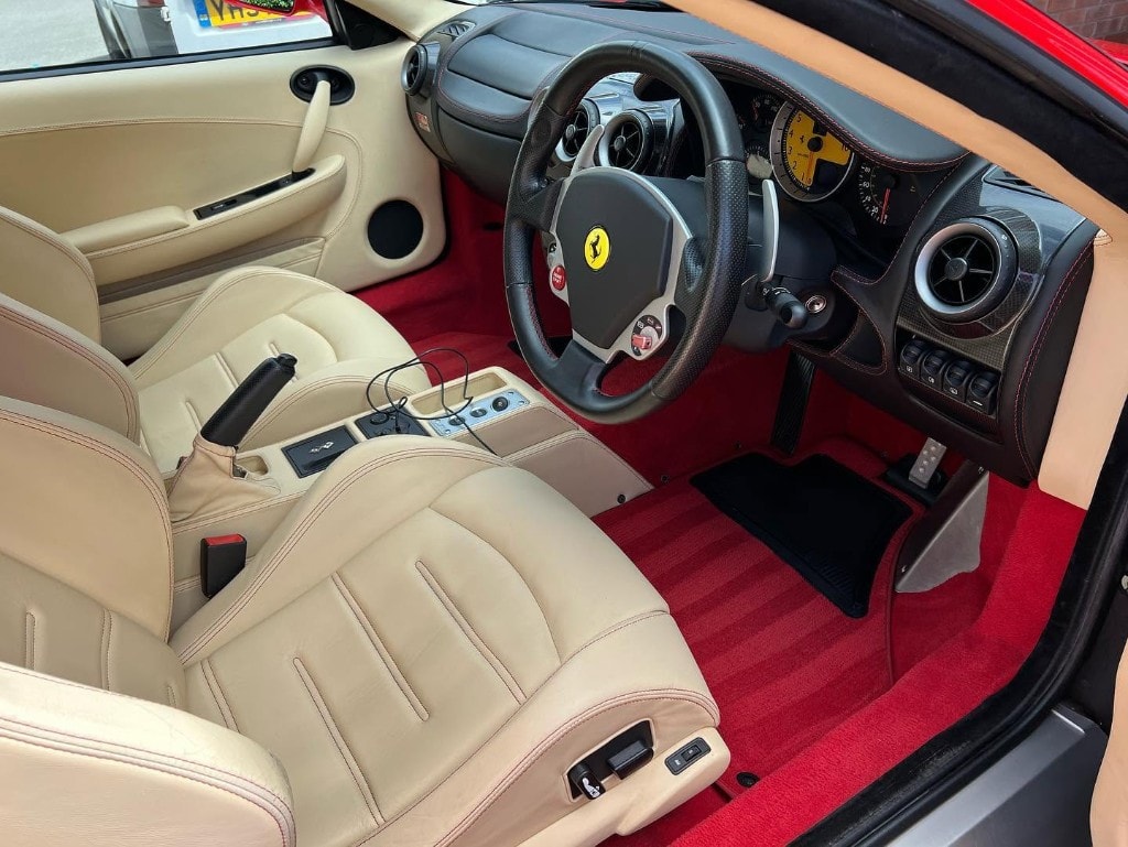 Ferrari F430 cream leather seats and red carpet detailed