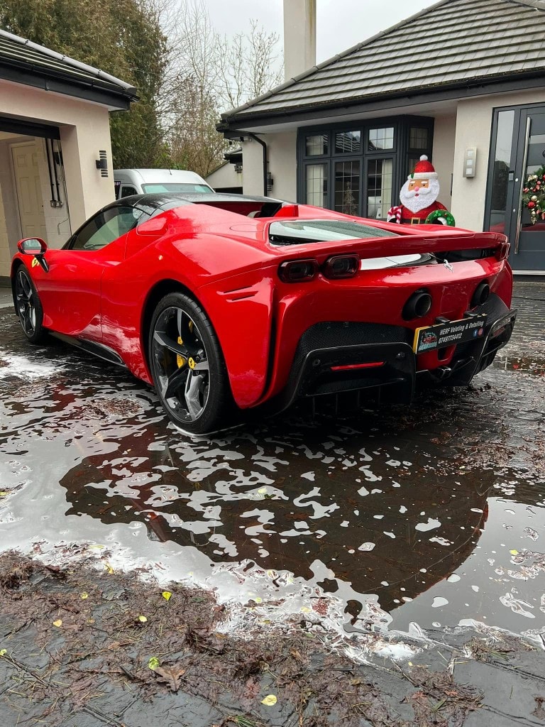 Red Ferrari SF90 Stradale mid snow-foam pre-wash