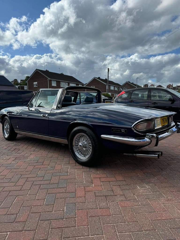 Classic blue Triumph Stag rear three-quarter, soft top up